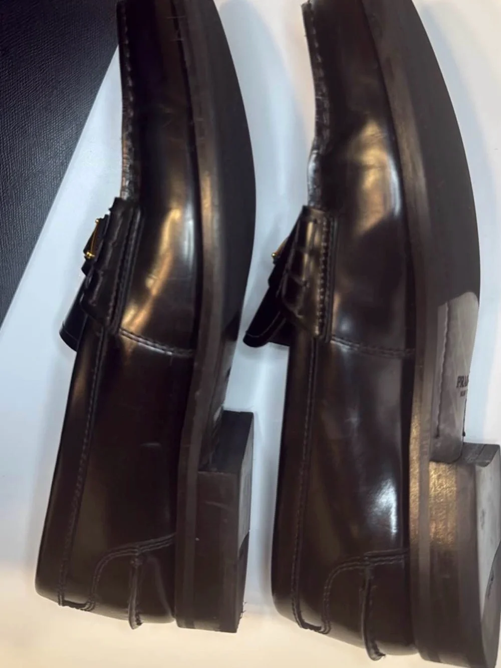 Prada Black Leather Men's Slip-On Loafers with Gold Logo